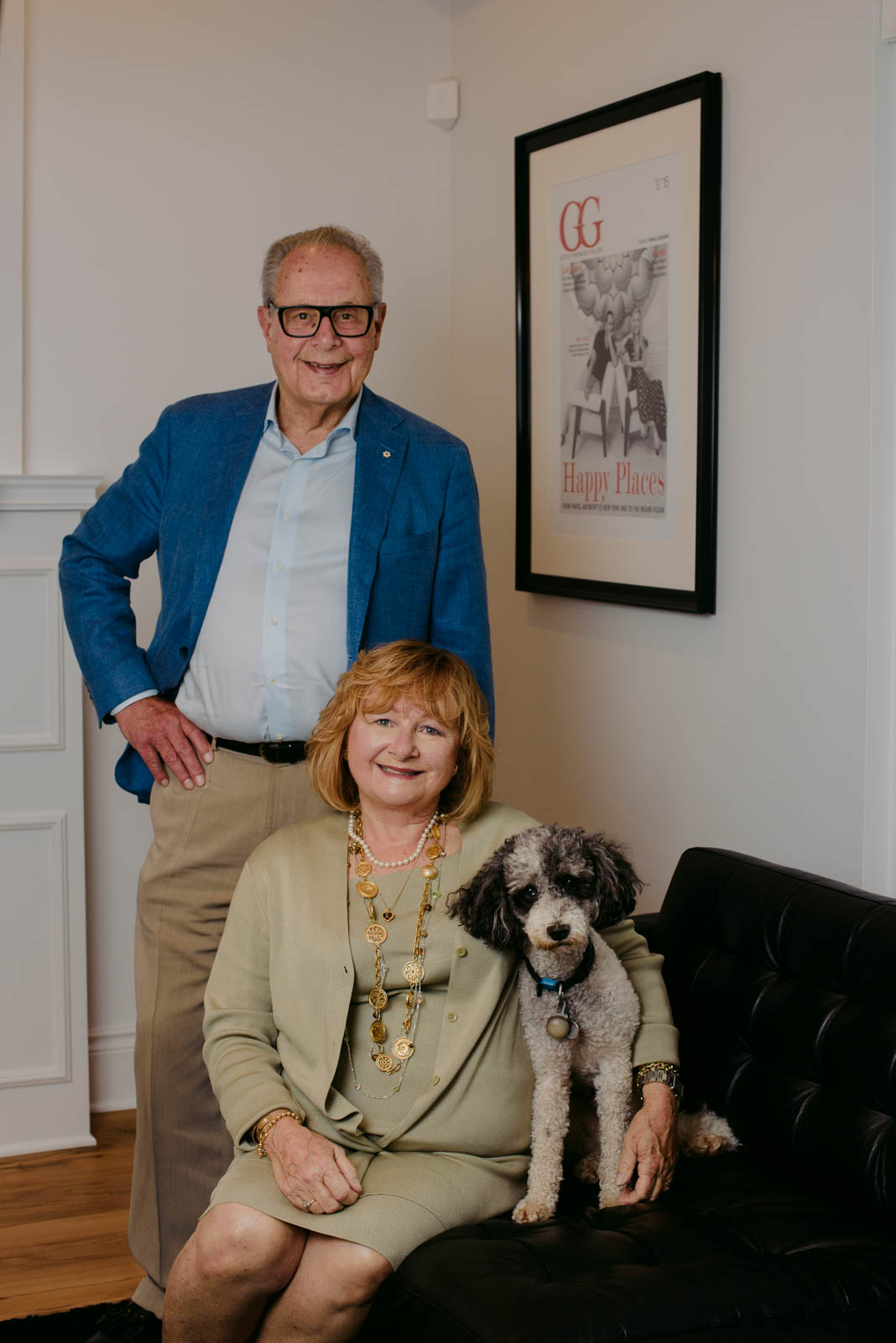 real estate agent team Nancy and Frank O'Dea with their dog inside Engel and Volkers offices