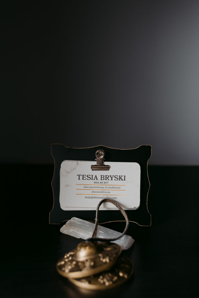 Therapist Tesia Bryski name tag on her bookshelf