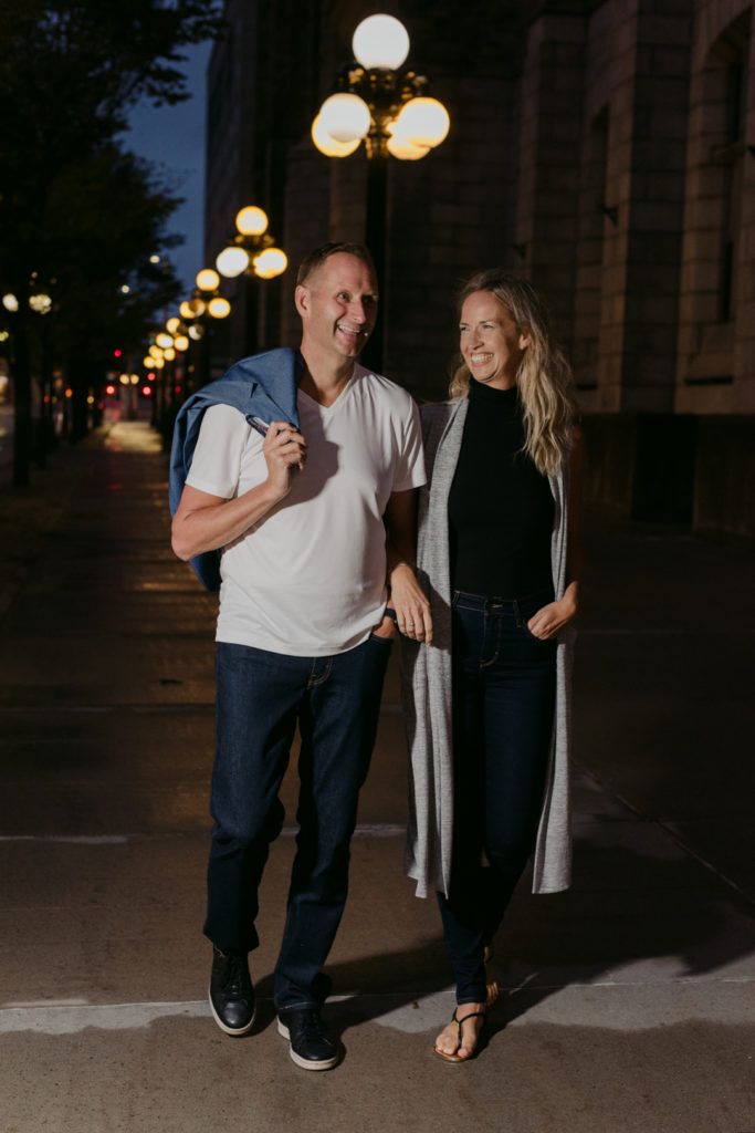 man and wife business owners walking the streets of downtown Ottawa at night