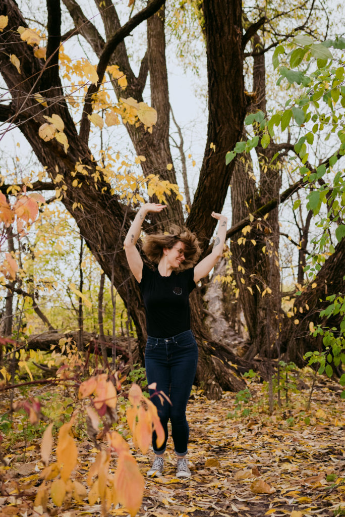 copywriter dancing in the forest in the fall
