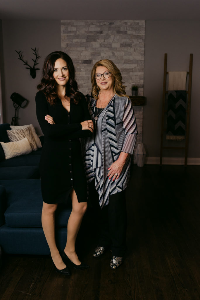 business women standing in a living room