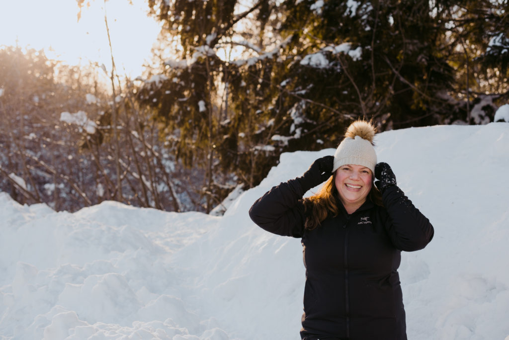 real estate agent Daria Kark pulling down her toque in the snow