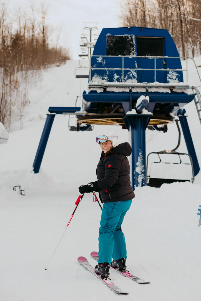 Daria Kark real estate agent with her skis on at the bottom of Camp Fortune chair lift