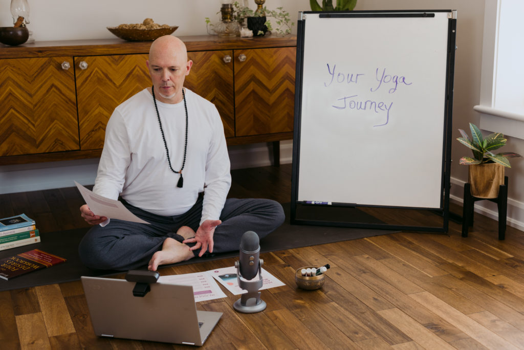 yoga teacher teaching virtual teacher training class