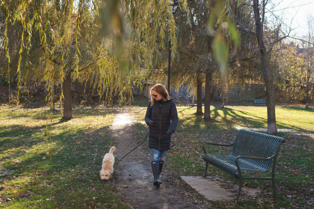 Stephanie Kay walking her dog through the park