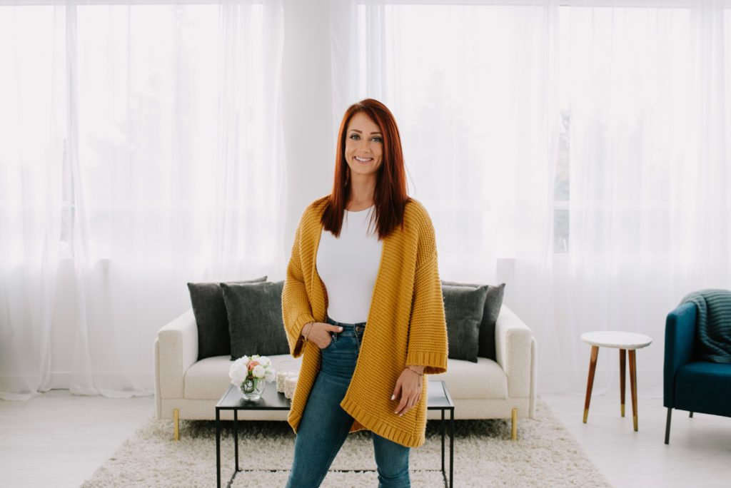 woman entrepreneur wearing yellow sweater in a living room