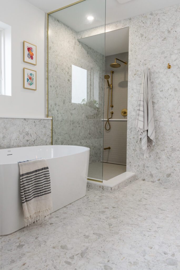 white and grey floor to ceiling tile in modern bathroom renovation